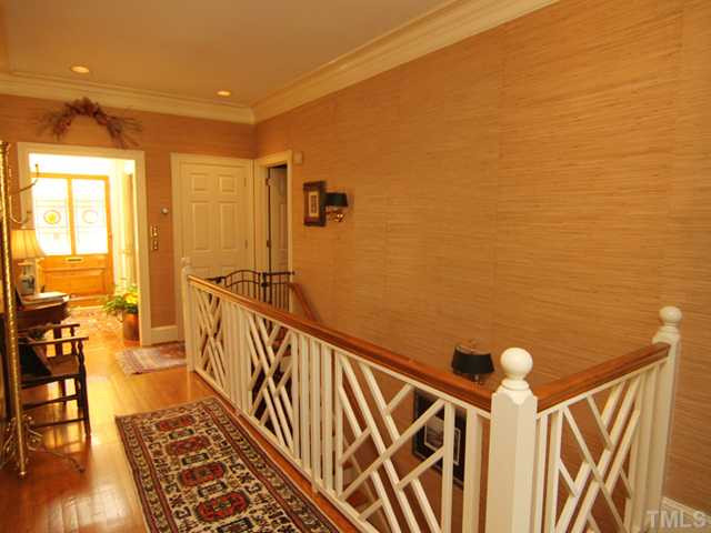 3511 Darwin Road Durham, NC 27707 - Photo 3 of 25 Lovely hardwoods everywhere! Stairs to lower level Bonus and two bedrooms.Beautiful Chippendale rail. Foyer