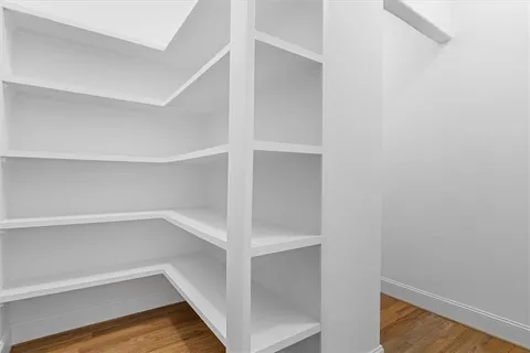 a living room with furniture large window and a fireplace