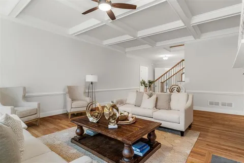 a kitchen with kitchen island granite countertop a sink stainless steel appliances and cabinets