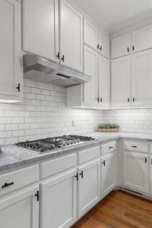 a spacious bedroom with a bed and ceiling fan