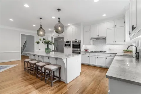 a bathroom with a sink and a window
