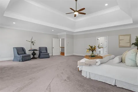 a view of an empty room with a cabinet and mirrors