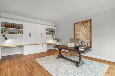 a view of entryway and hall with wooden floor