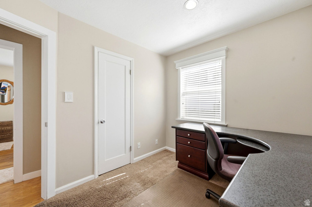310 East 600 South Centerville, UT 84014 - Photo 15 of 41 Neutral tone walls complement the carpeted flooring
