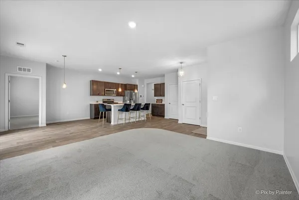 a view of kitchen with furniture and window