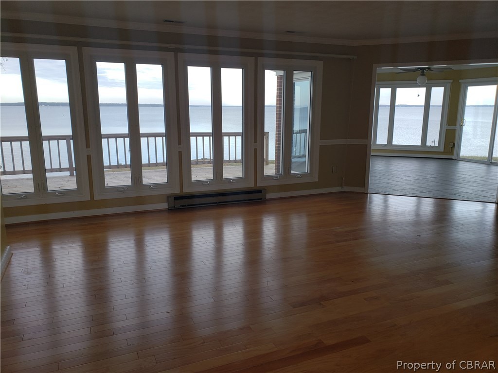 589 Brandon Point Road Locust Hill, VA 23092 - Photo 11 of 39 Formal living room waterside looking toward River Room and exterior deck