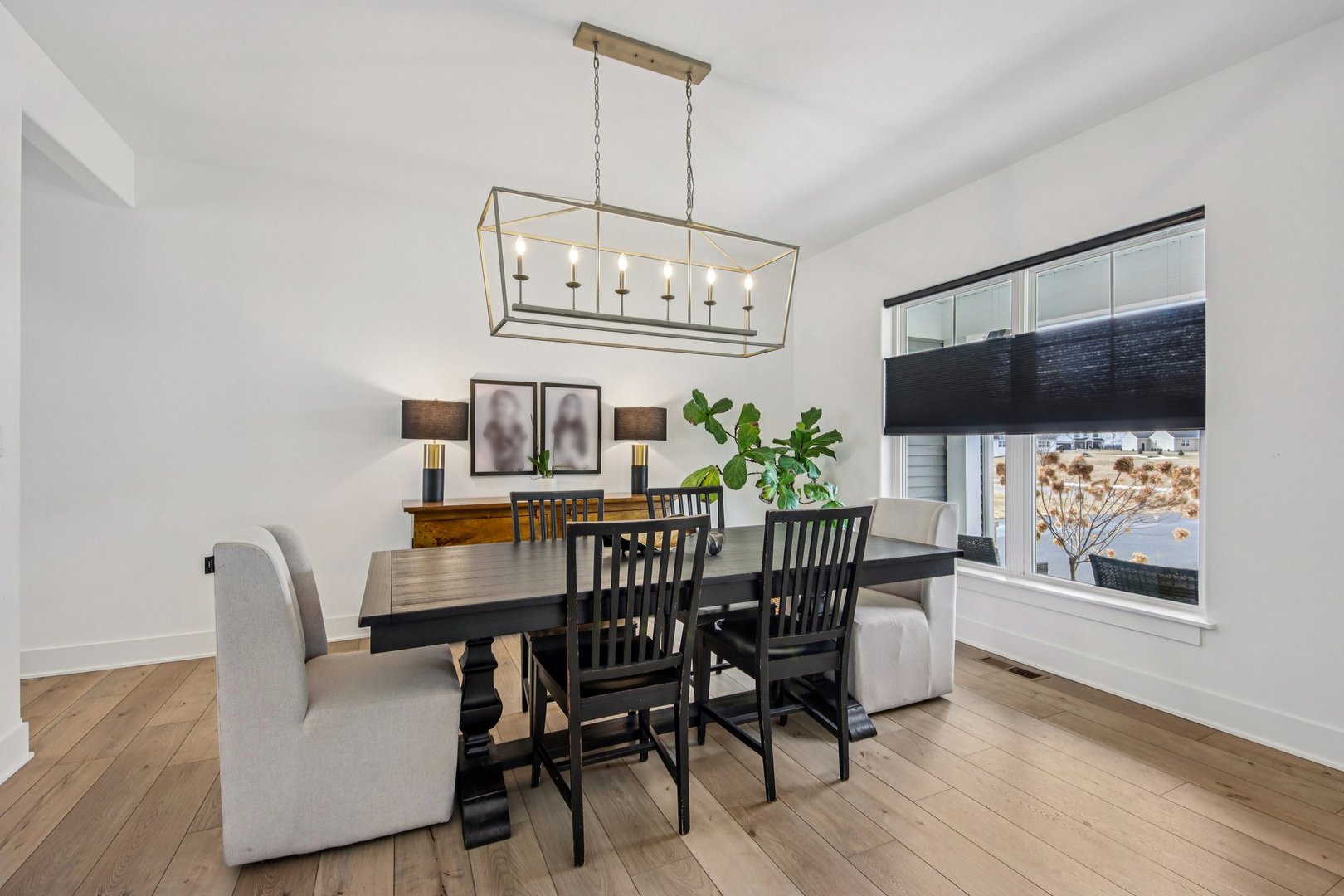 3276 Cornflower Way Spring Grove, IL 60081 - Photo 12 of 48 a view of a dining room with furniture wooden floor and chandelier
