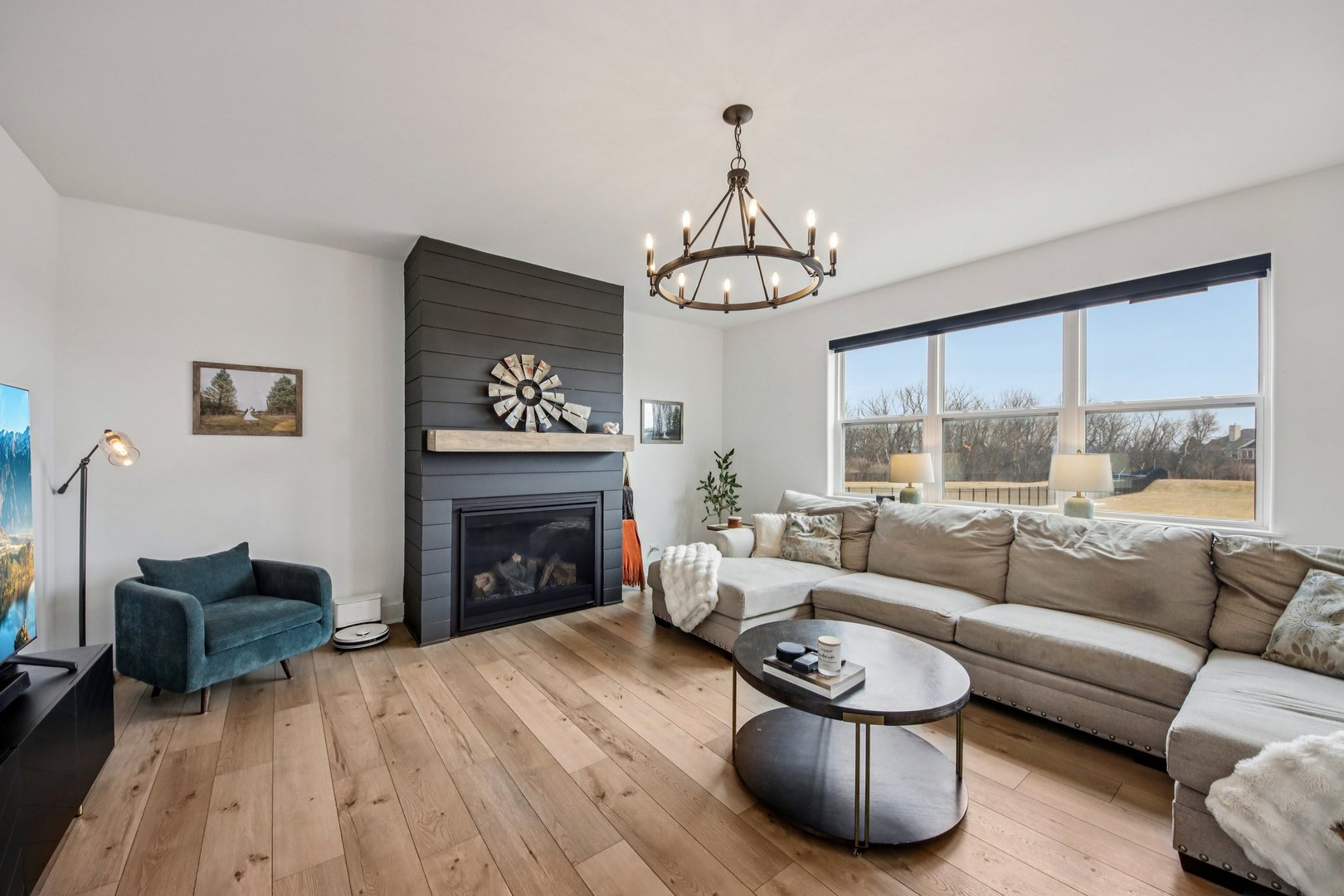3276 Cornflower Way Spring Grove, IL 60081 - Photo 2 of 48 a living room with furniture a fireplace and a large window