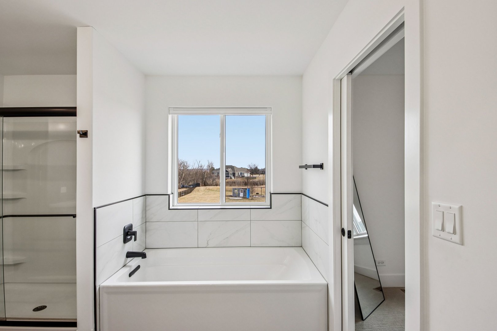 3276 Cornflower Way Spring Grove, IL 60081 - Photo 24 of 48 a bathroom with a bathtub and a shower