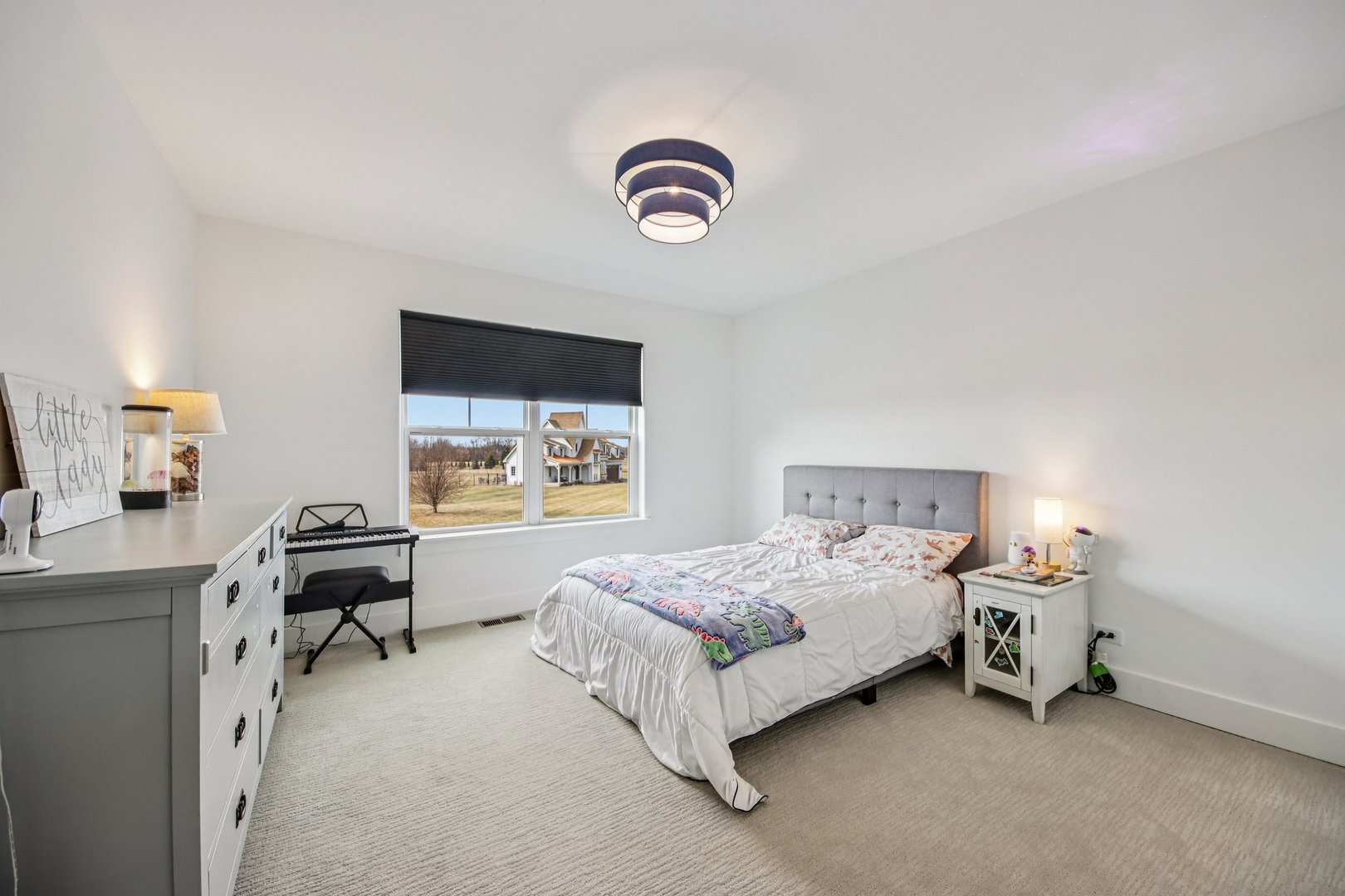 3276 Cornflower Way Spring Grove, IL 60081 - Photo 28 of 48 a bedroom with a bed and a chandelier