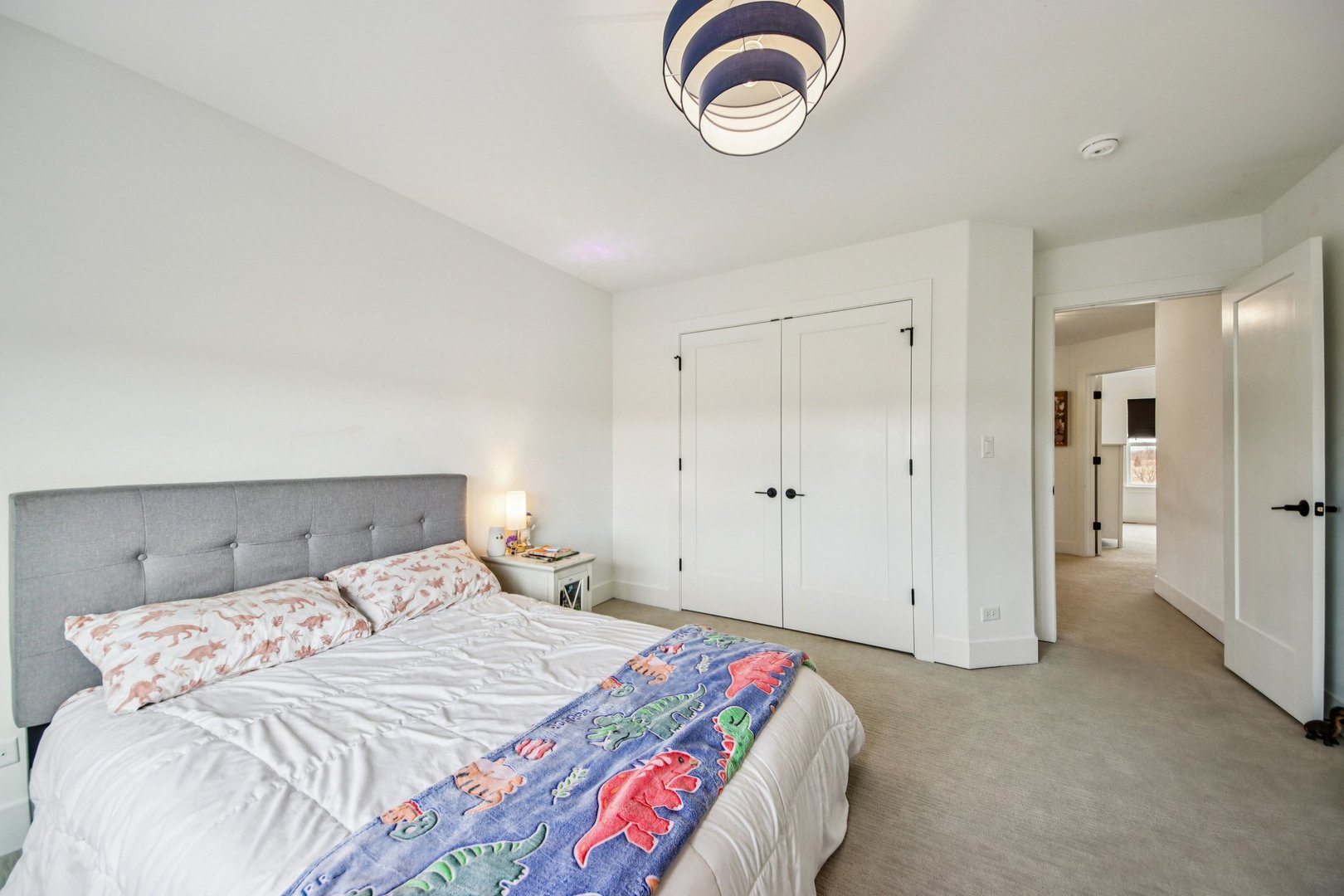 3276 Cornflower Way Spring Grove, IL 60081 - Photo 29 of 48 a bedroom with a bed and a chandelier