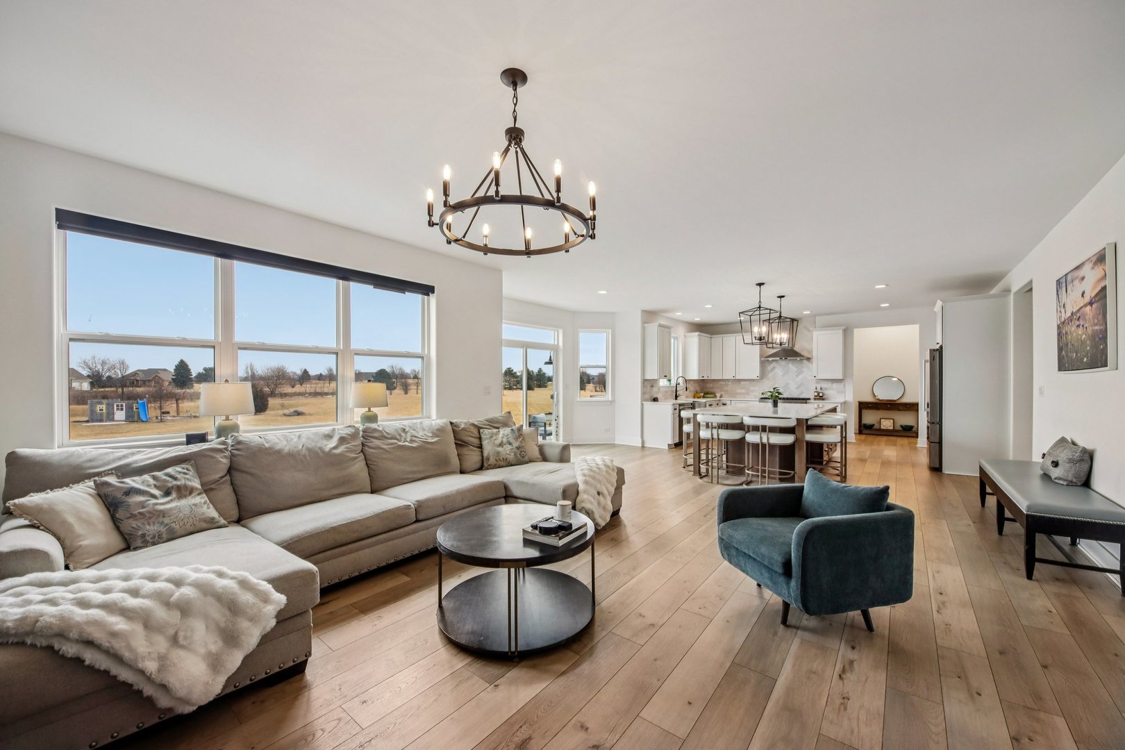 3276 Cornflower Way Spring Grove, IL 60081 - Photo 3 of 48 a living room with furniture kitchen view and a chandelier