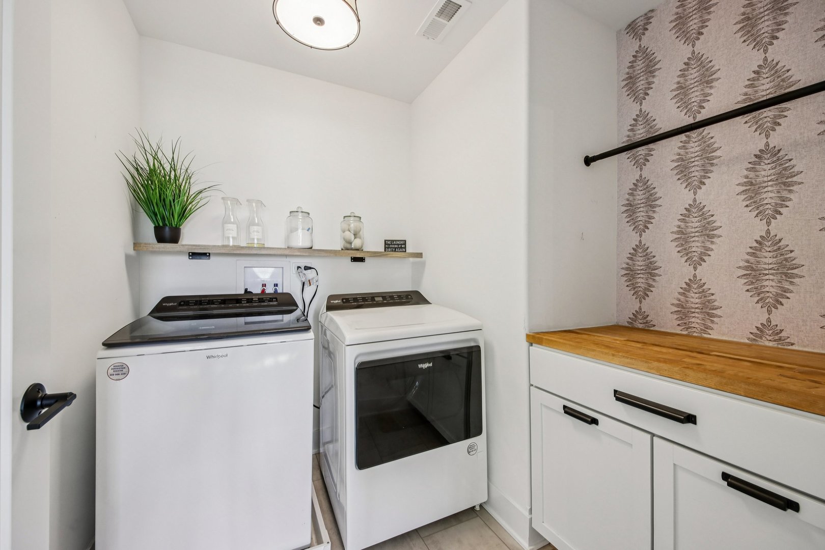 3276 Cornflower Way Spring Grove, IL 60081 - Photo 34 of 48 a view of washer and dryer with kitchen in the background