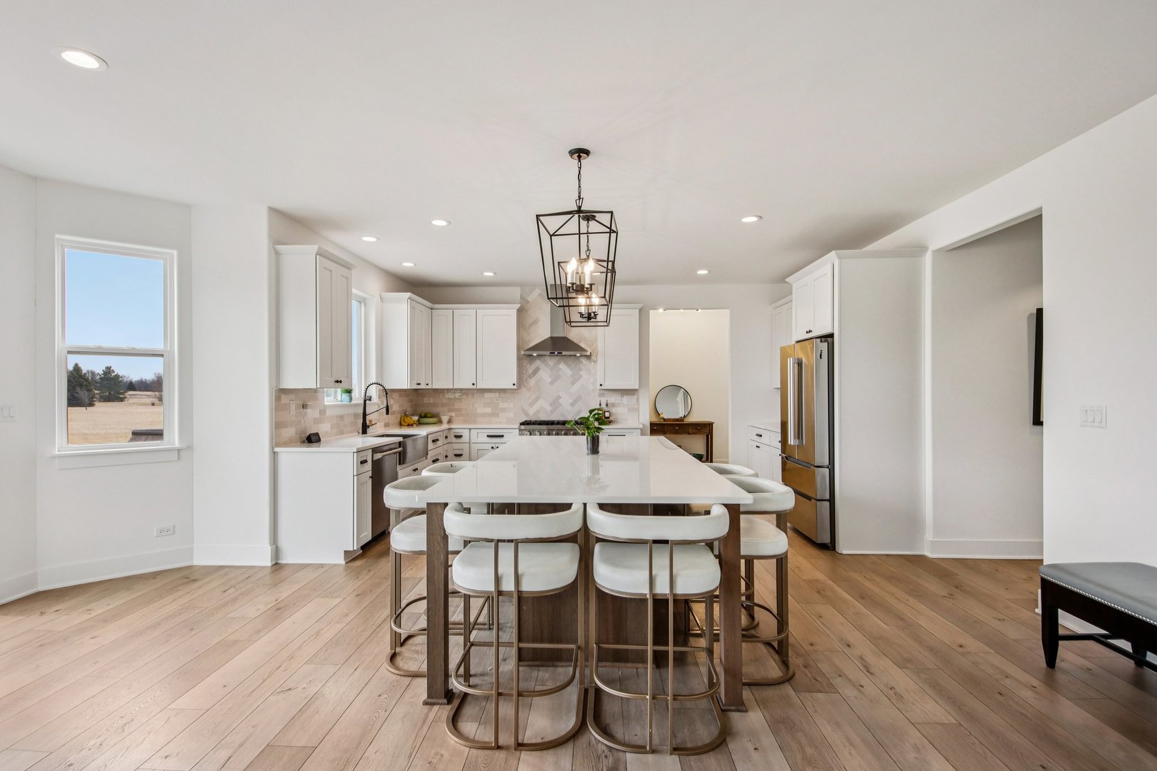 3276 Cornflower Way Spring Grove, IL 60081 - Photo 5 of 48 a view of a dining room with furniture wooden floor and chandelier