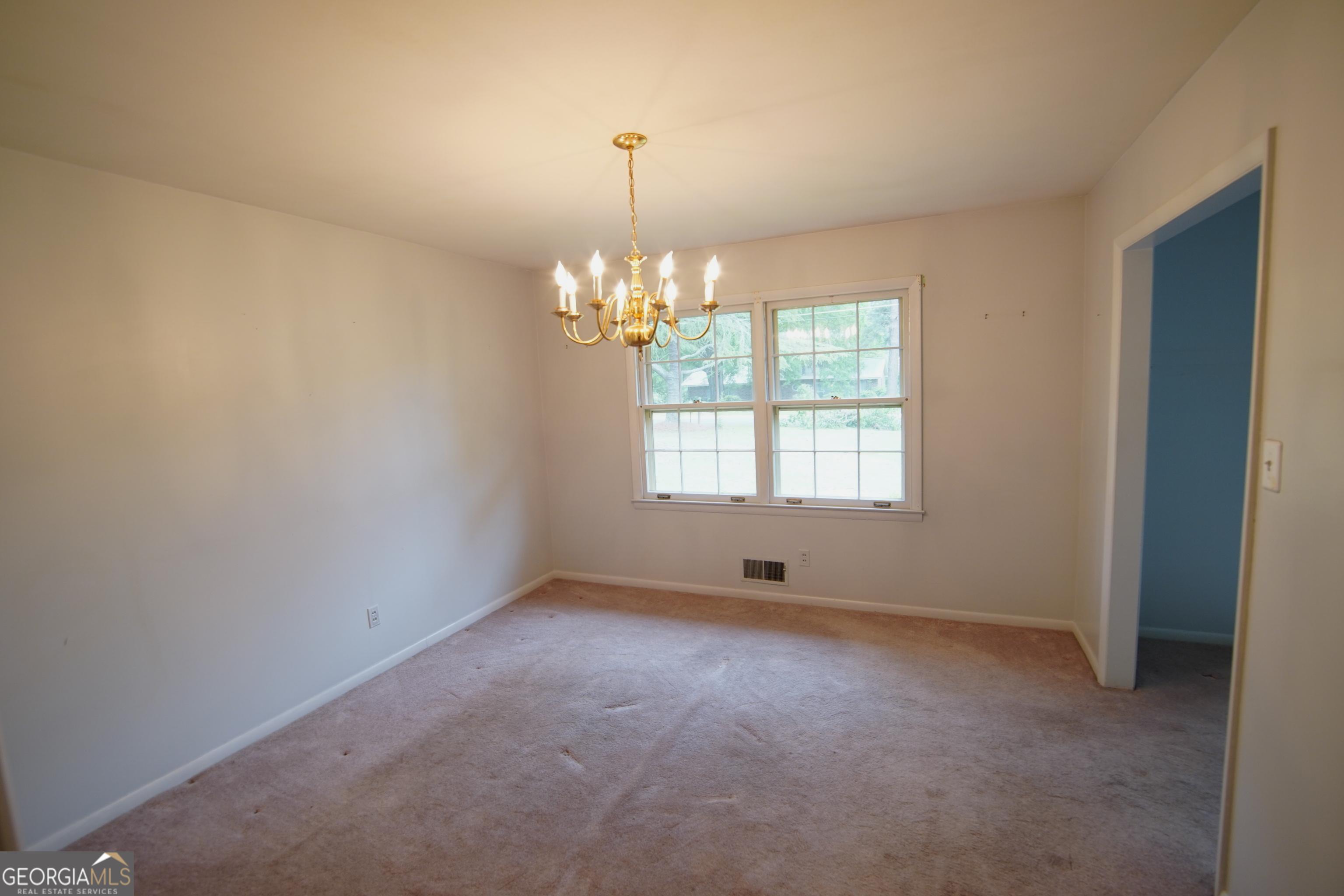 1712 Briarcliff Road Milledgeville, GA 31061 - Photo 16 of 38 a view of an empty room with windows