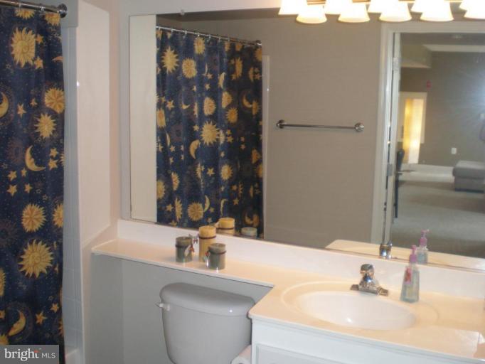 11710 Old Georgetown Road, Unit 408 Rockville, MD 20852 - Photo 16 of 27 a bathroom with a sink and a mirror