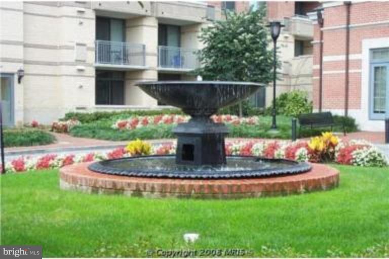 11710 Old Georgetown Road, Unit 408 Rockville, MD 20852 - Photo 20 of 27 a view of a house with a yard and sitting area