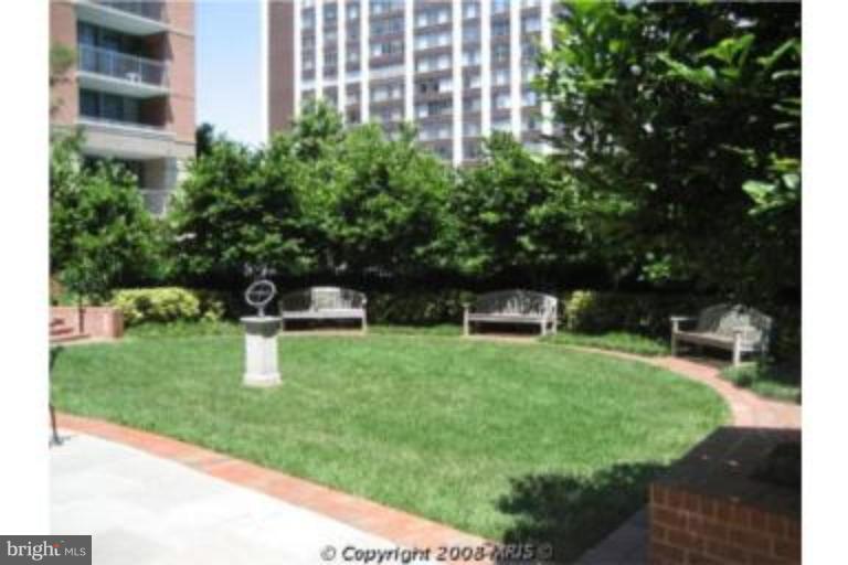 11710 Old Georgetown Road, Unit 408 Rockville, MD 20852 - Photo 22 of 27 a front view of a house with a yard