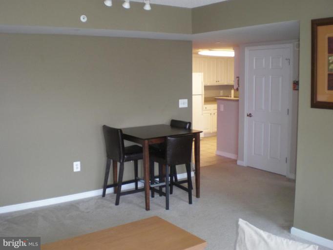 11710 Old Georgetown Road, Unit 408 Rockville, MD 20852 - Photo 5 of 27 a view of a dining room with furniture