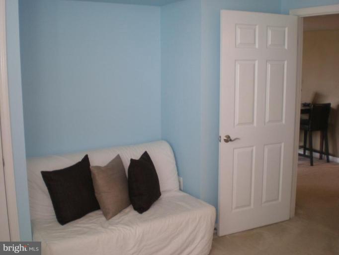 11710 Old Georgetown Road, Unit 408 Rockville, MD 20852 - Photo 10 of 27 a bed room with a bed