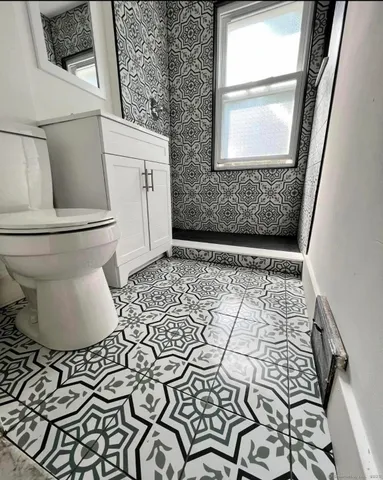 a bathroom with a sink and a toilet