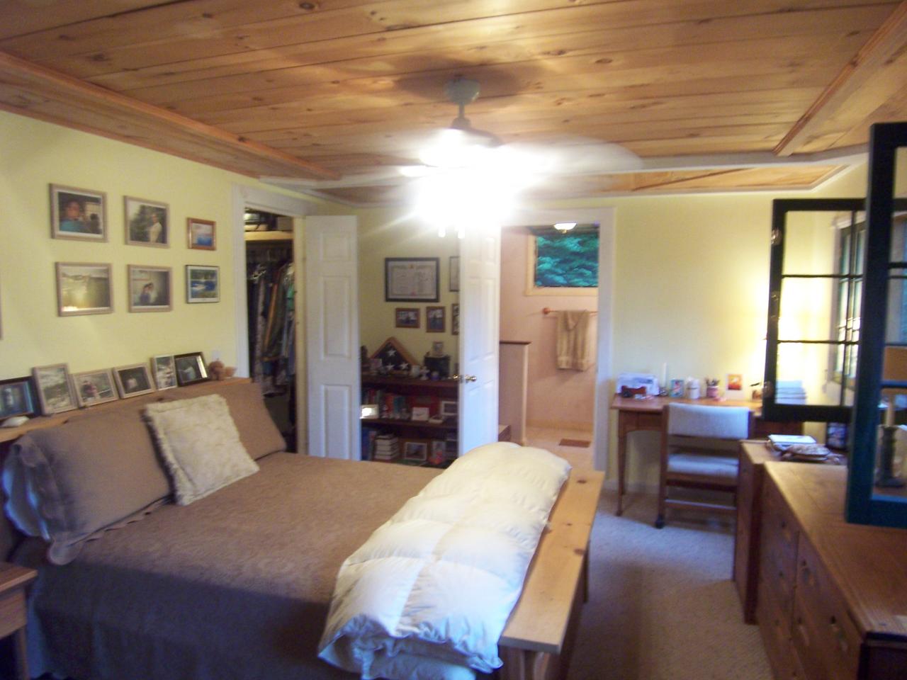 169 Bailey Hill Road Readsboro, VT 05350 - Photo 5 of 7 a bedroom with furniture and a large window