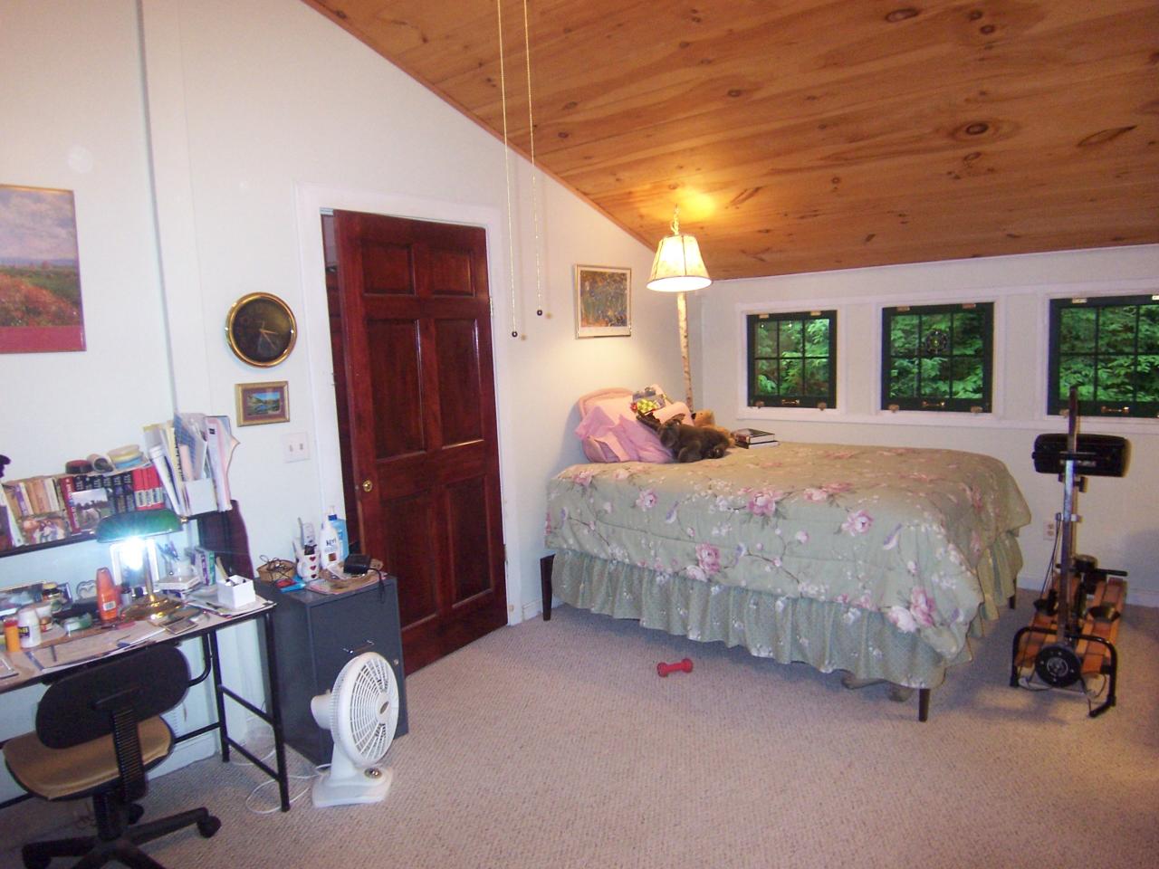 169 Bailey Hill Road Readsboro, VT 05350 - Photo 7 of 7 a bedroom with a bed and a dresser next to a window