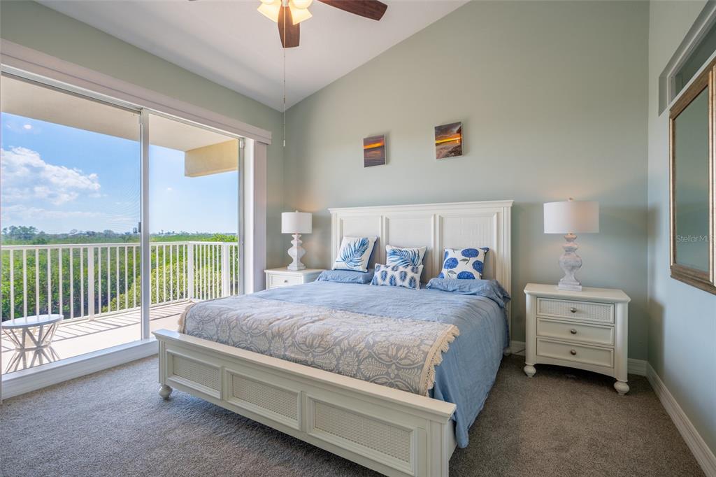 3230 Mangrove Point Drive Ruskin, FL 33570 - Photo 18 of 44 a bedroom with a bed and a chandelier