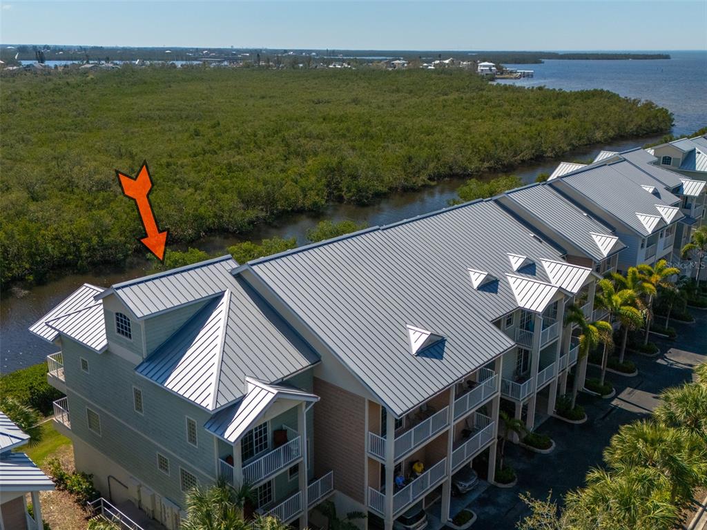 3230 Mangrove Point Drive Ruskin, FL 33570 - Photo 2 of 44 an aerial view of a house with a lake view