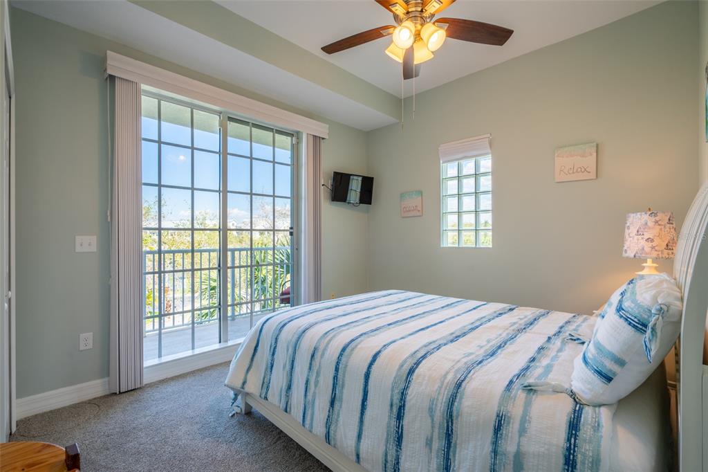 3230 Mangrove Point Drive Ruskin, FL 33570 - Photo 28 of 44 a bedroom with a bed and a window