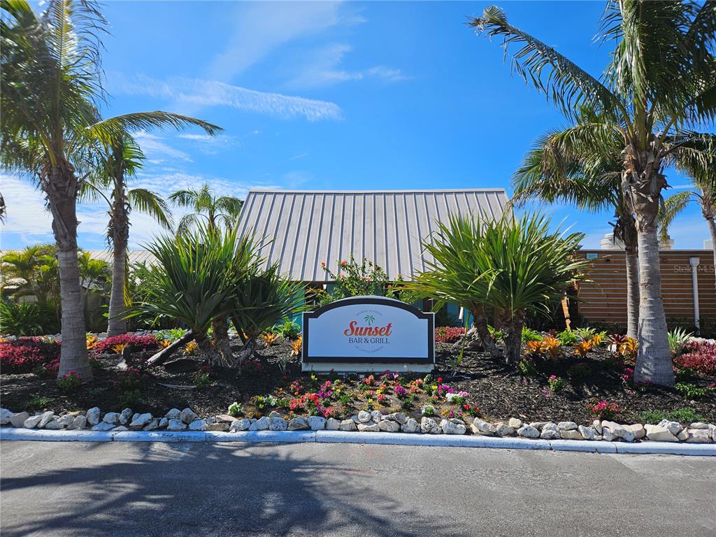 3230 Mangrove Point Drive Ruskin, FL 33570 - Photo 43 of 44 a sign that is on the side of a road