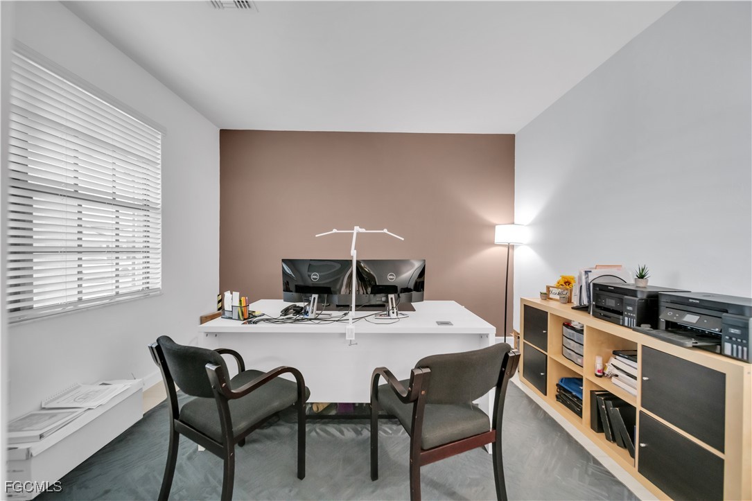 11264 Canopy Loop Fort Myers, FL 33913 - Photo 12 of 49 a dining room with a table and chairs