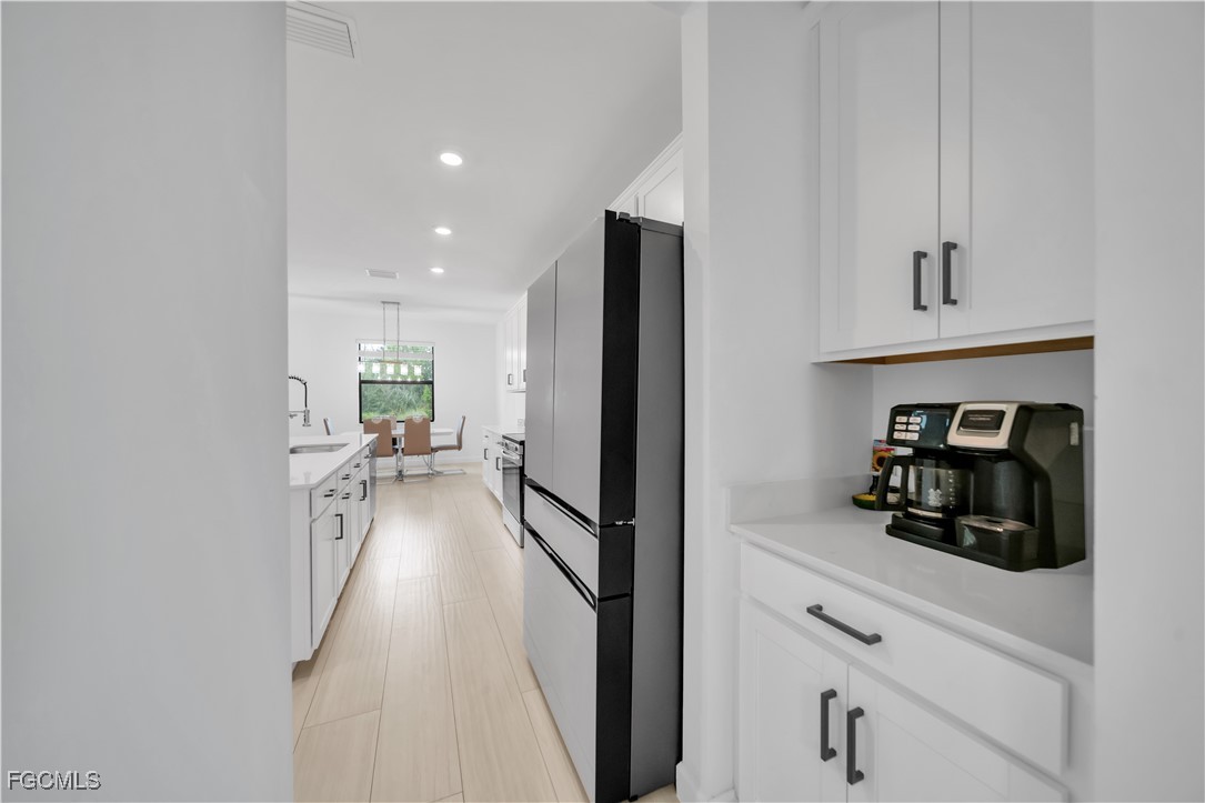 11264 Canopy Loop Fort Myers, FL 33913 - Photo 15 of 49 a view of a kitchen from the hallway