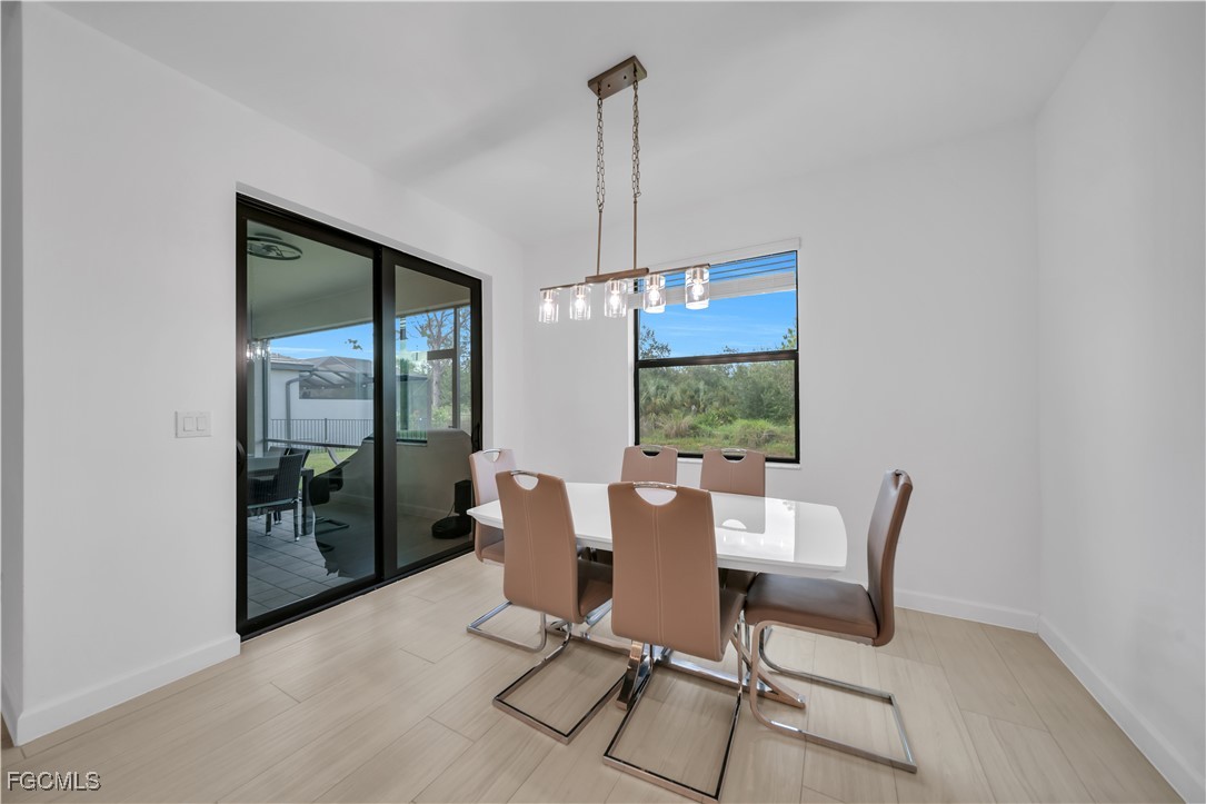 11264 Canopy Loop Fort Myers, FL 33913 - Photo 17 of 49 a view of a dining room with furniture window and outside view