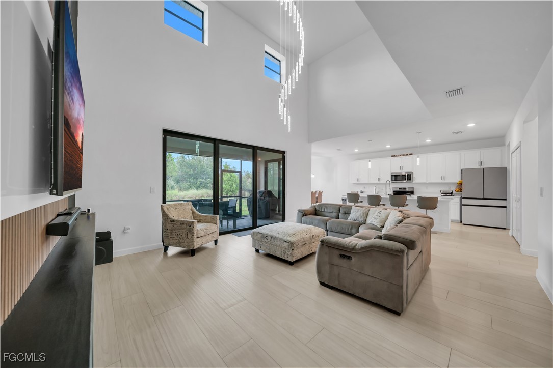 11264 Canopy Loop Fort Myers, FL 33913 - Photo 19 of 49 a living room with furniture and a flat screen tv