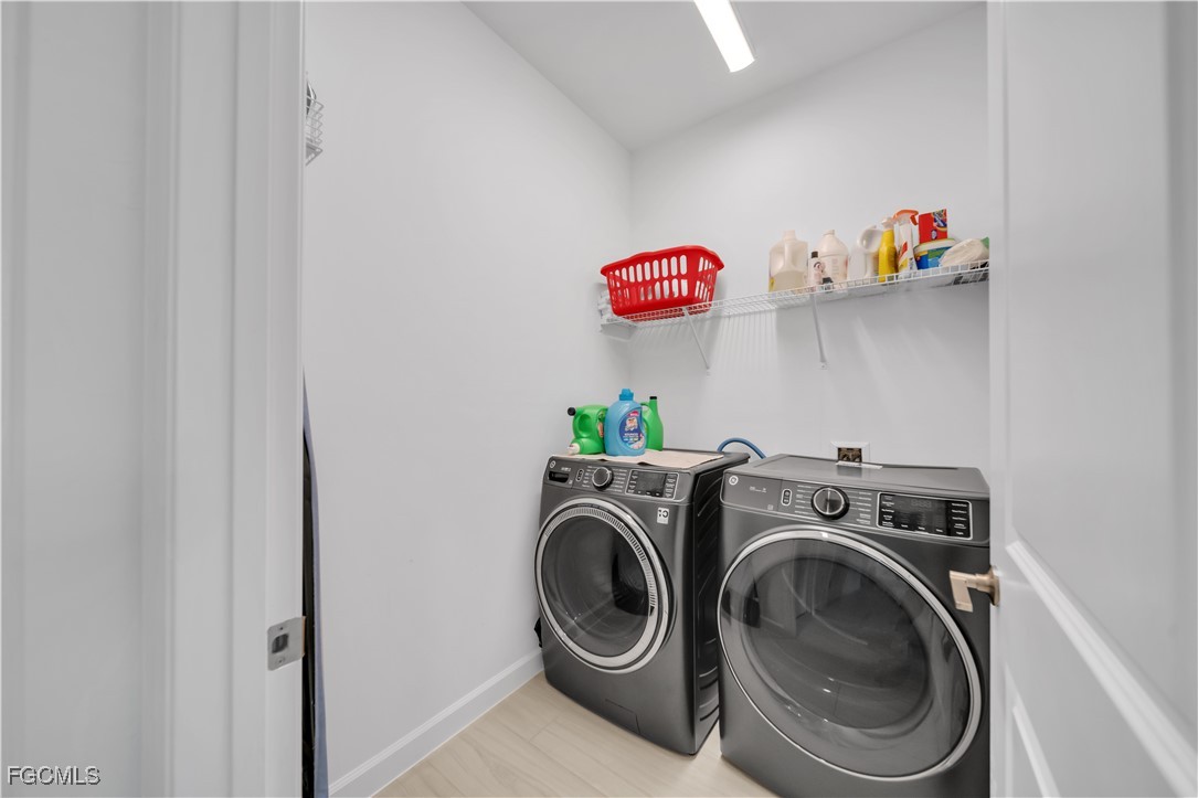 11264 Canopy Loop Fort Myers, FL 33913 - Photo 22 of 49 a view of storage and utility room with washer and dryer