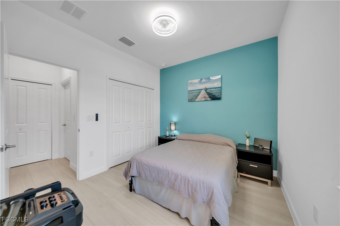 11264 Canopy Loop Fort Myers, FL 33913 - Photo 24 of 49 a bedroom with a bed and a window