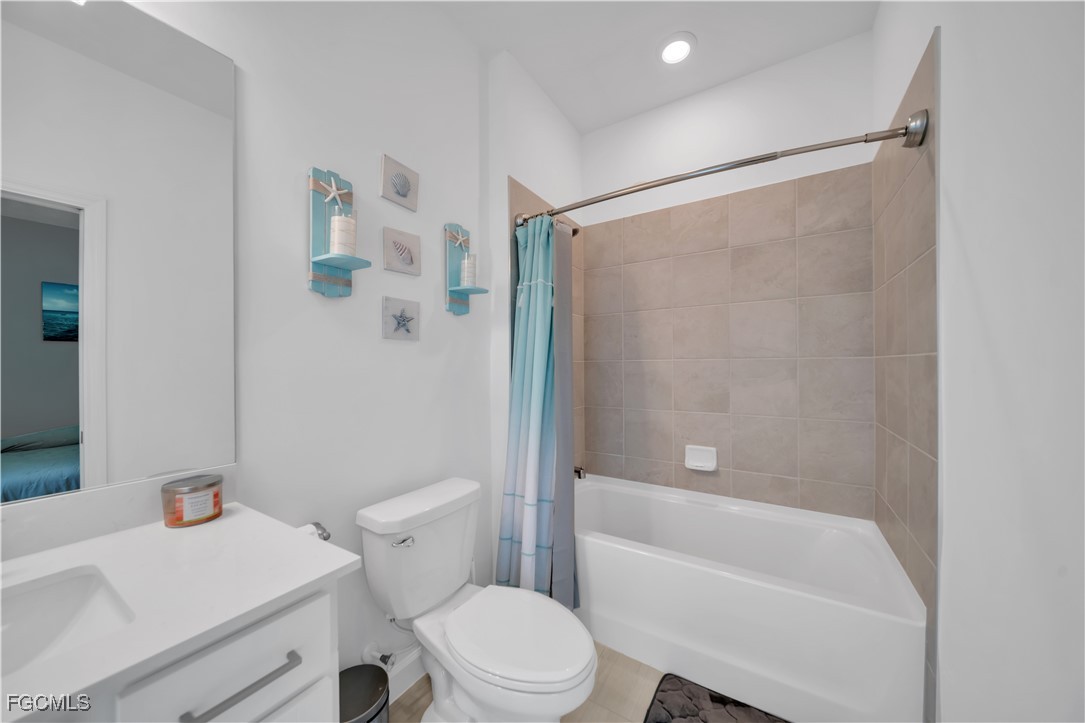 11264 Canopy Loop Fort Myers, FL 33913 - Photo 26 of 49 a bathroom with a sink a toilet and a bathtub