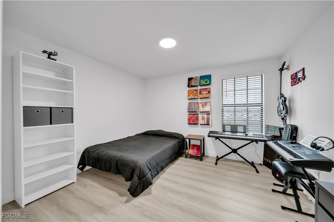 11264 Canopy Loop Fort Myers, FL 33913 - Photo 37 of 49 a bedroom with furniture and a window