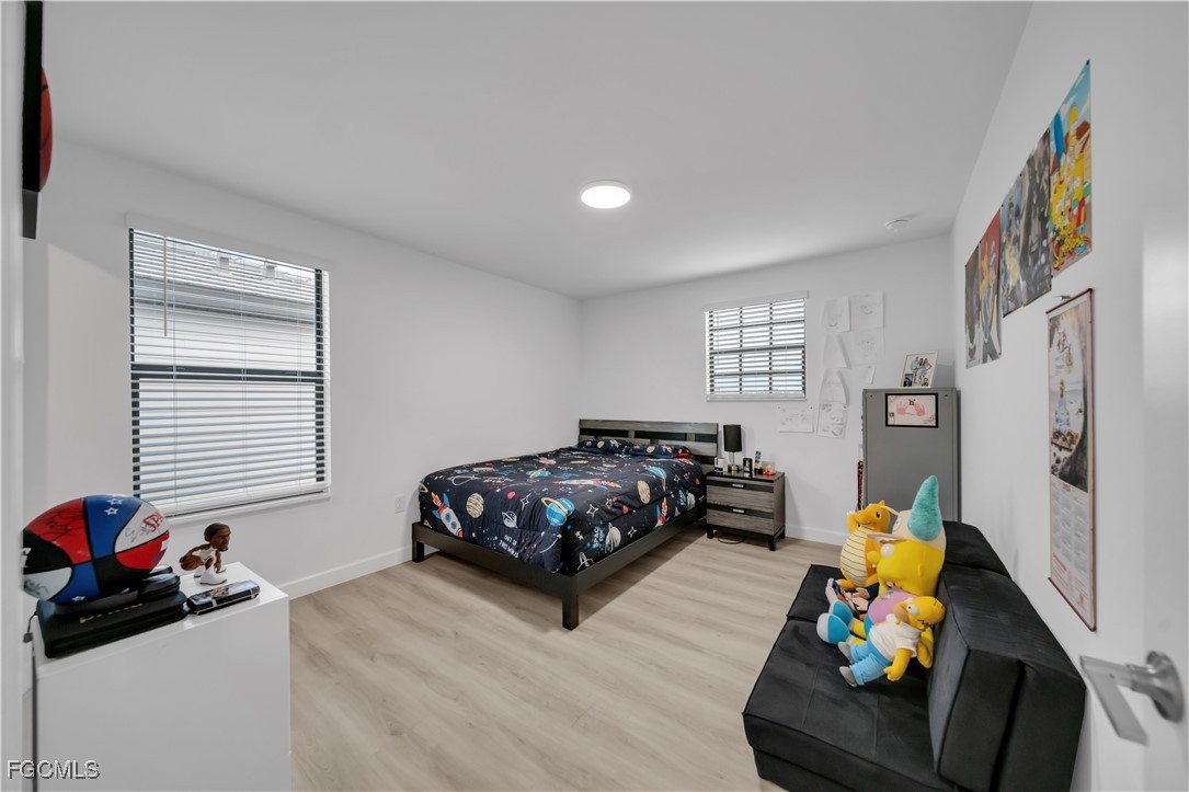 11264 Canopy Loop Fort Myers, FL 33913 - Photo 43 of 49 a bedroom with furniture and a window