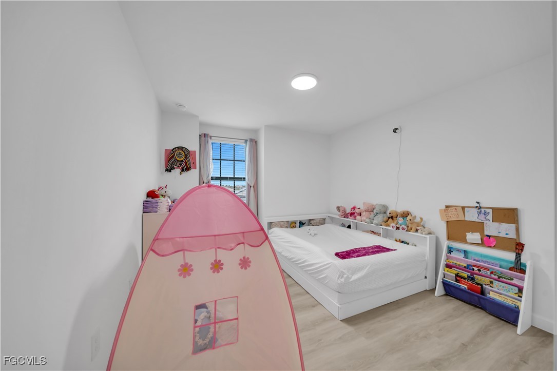 11264 Canopy Loop Fort Myers, FL 33913 - Photo 45 of 49 a bedroom with a bed and a dresser