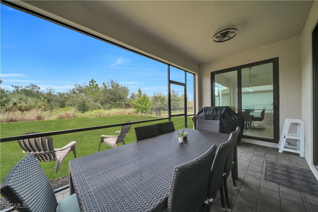 11264 Canopy Loop Fort Myers, FL 33913 - Photo 48 of 49 a view of a balcony with chair and table