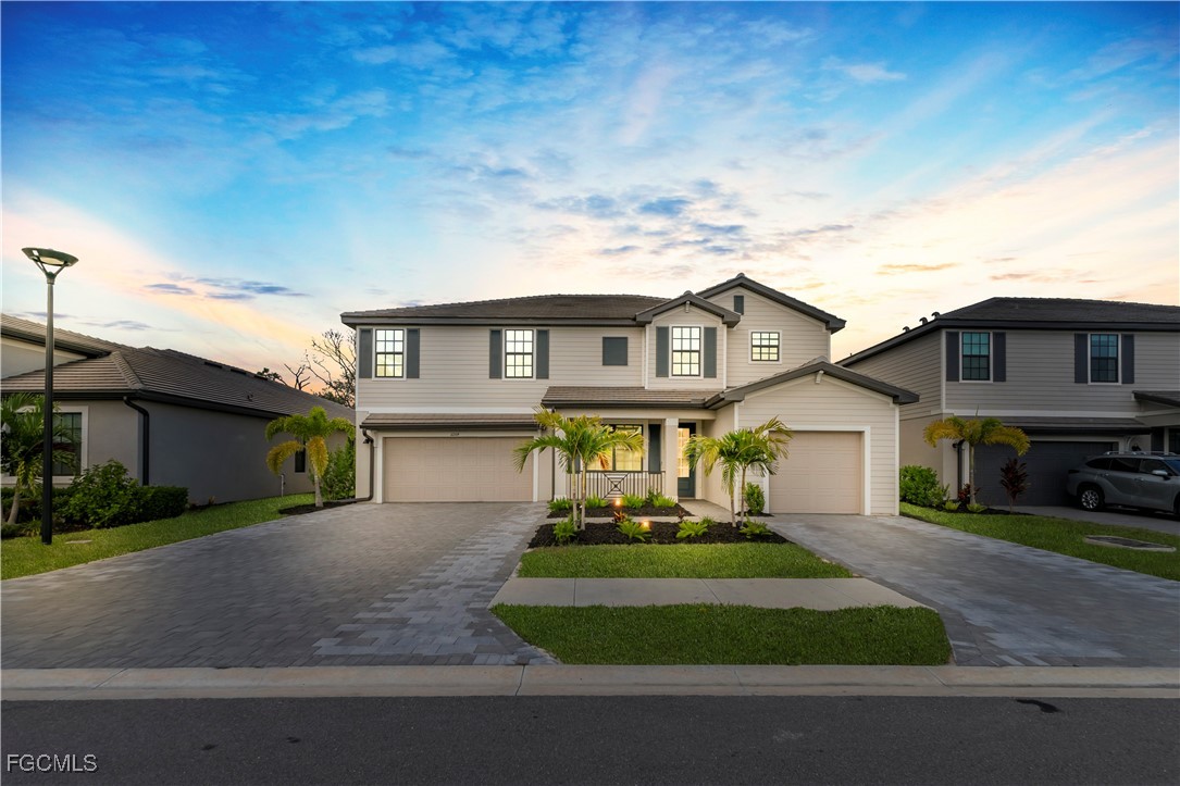 11264 Canopy Loop Fort Myers, FL 33913 - Photo 7 of 49 a front view of a house with a yard