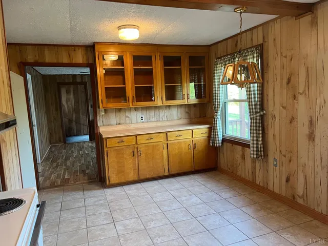 a kitchen with a stove a sink and a refrigerator