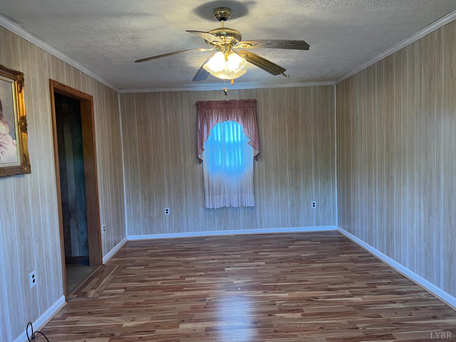 509 Riverbend Road Altavista, VA 24517 - Photo 9 of 25 wooden floor in an empty room with a window