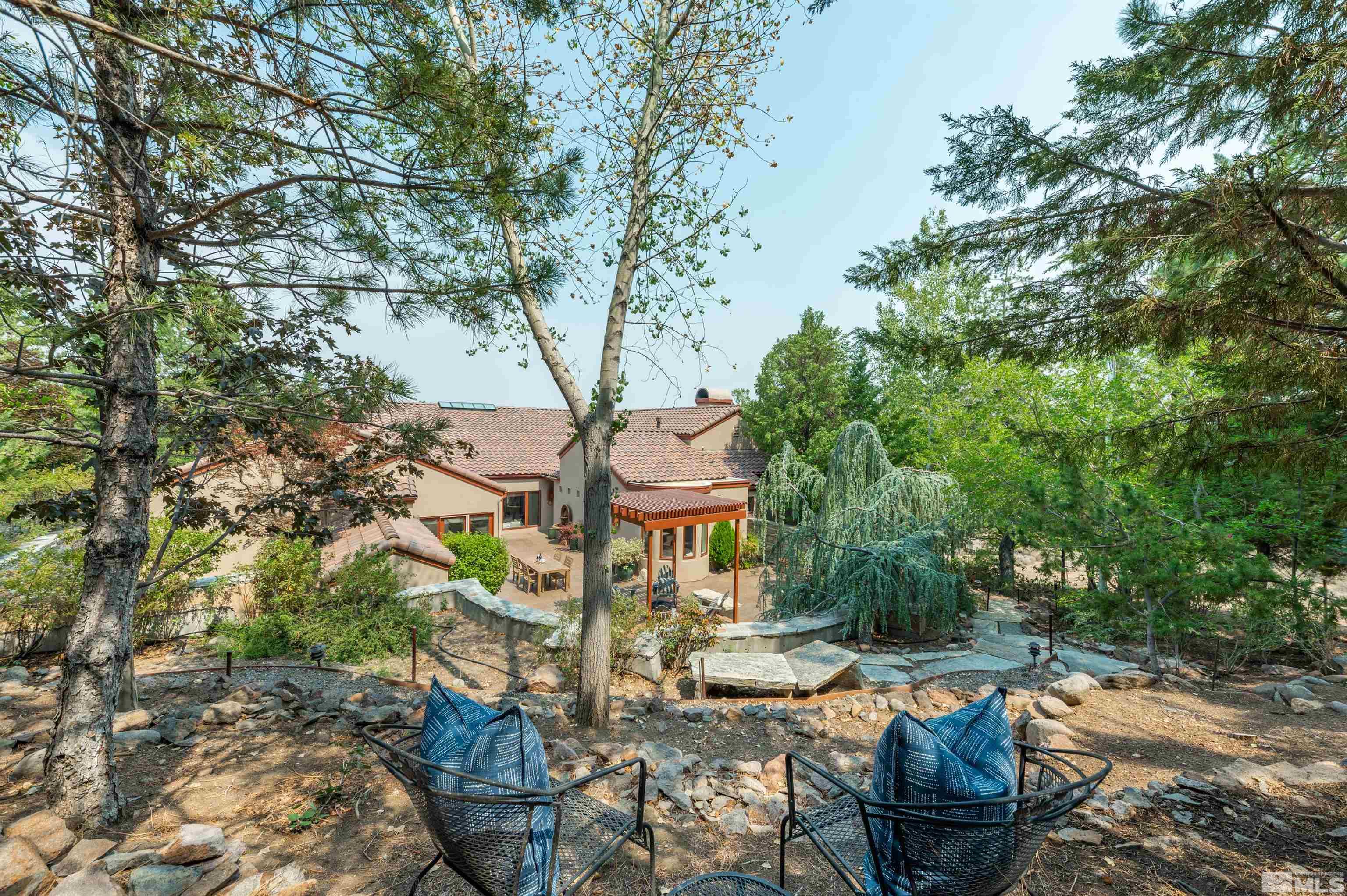 40 Sharps Circle Reno, NV 89519 - Photo 1 of 40 a view of a patio with table and chairs potted plants and large tree