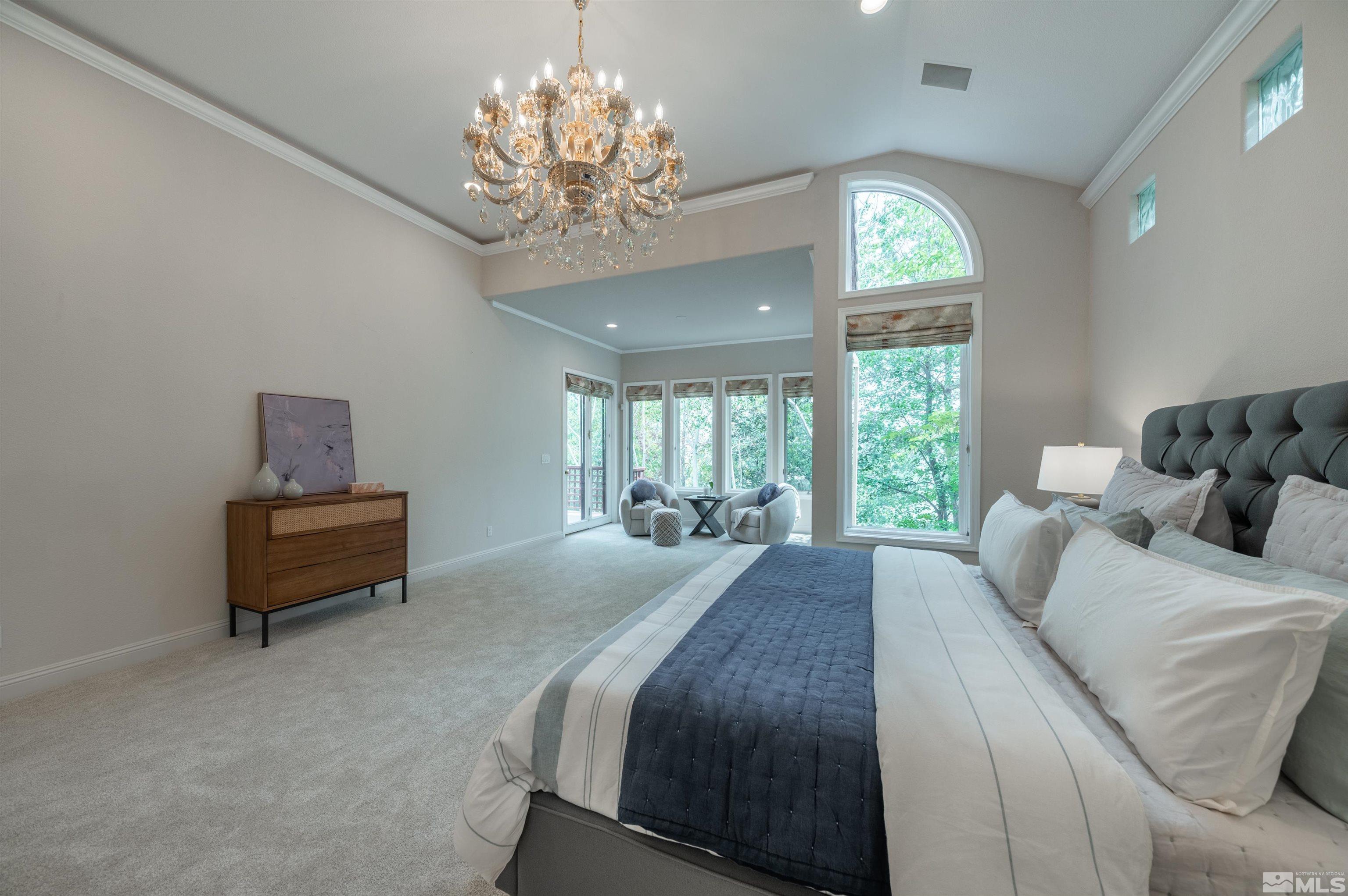 40 Sharps Circle Reno, NV 89519 - Photo 28 of 40 a bedroom with a bed and a chandelier
