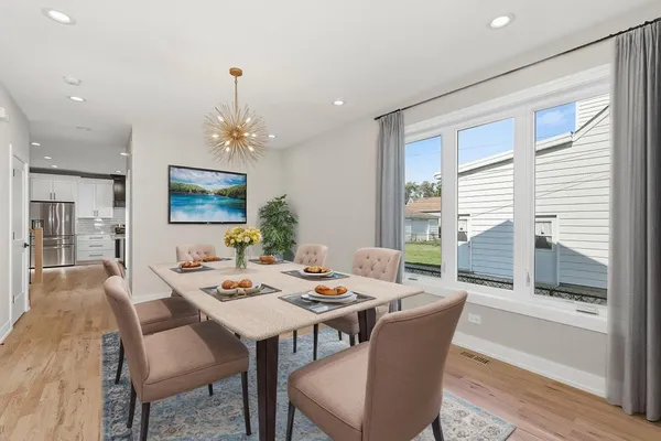 a view of a dining room with furniture window and outside view