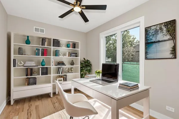 a workspace with furniture and window