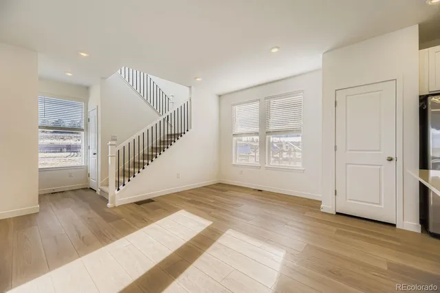 a bathroom with mirror and window